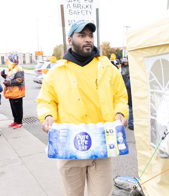 Handing out supplies in the yellow